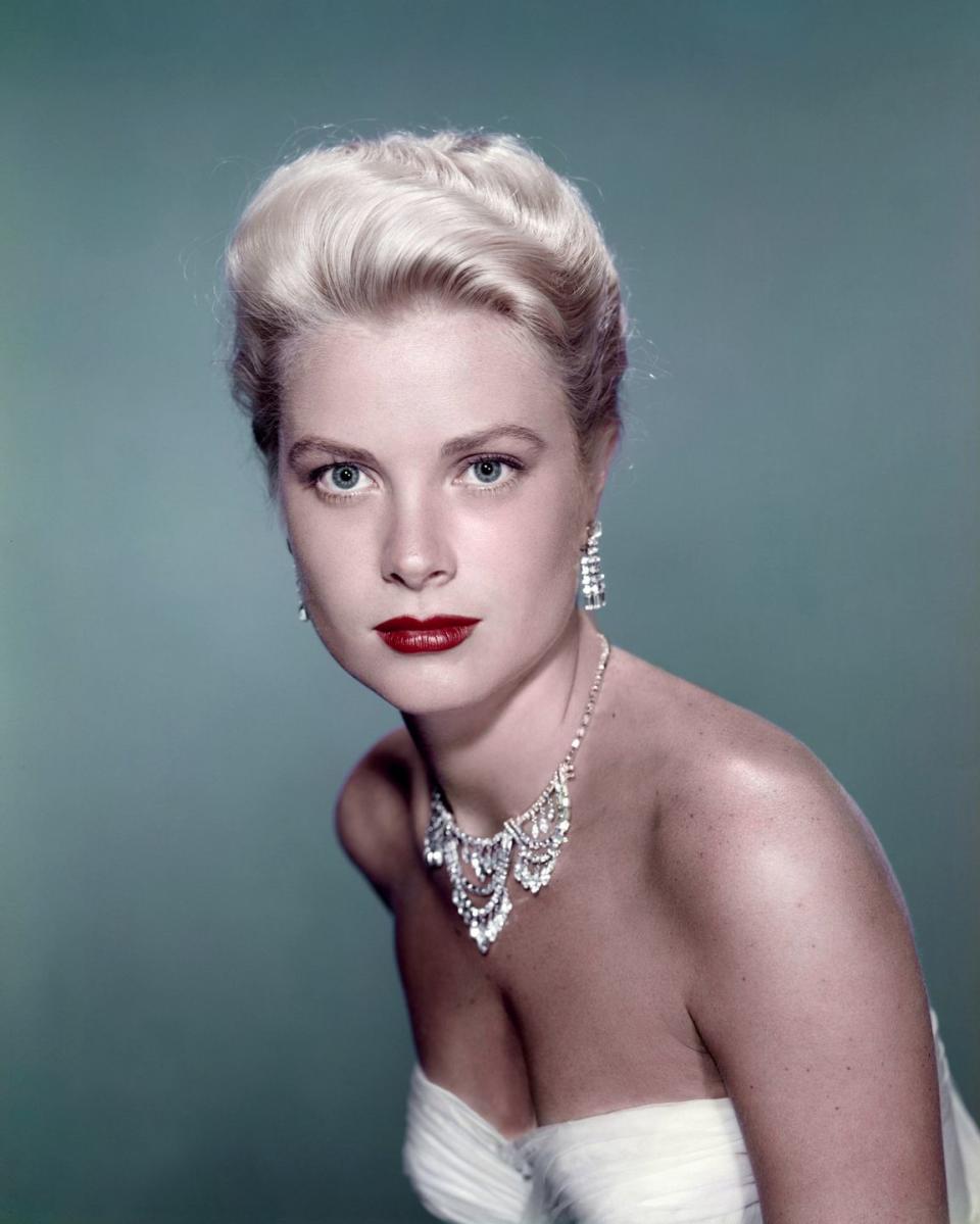 <p>Grace Kelly looked elegant in a tiered diamond necklace and fringe diamond earrings while in wardrobe from the 1955 classic, <em>To Catch a Thief</em>. Audiences expected nothing less from the Hollywood starlet. </p>