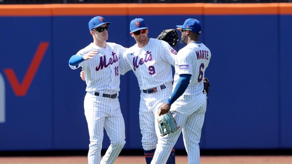 New York Mets left fielder Mark Canha (19) and center fielder Brandon Nimmo (9) and right fielder Starling Marte (6) celebrate after defeating the Philadelphia Phillies at Citi Field.