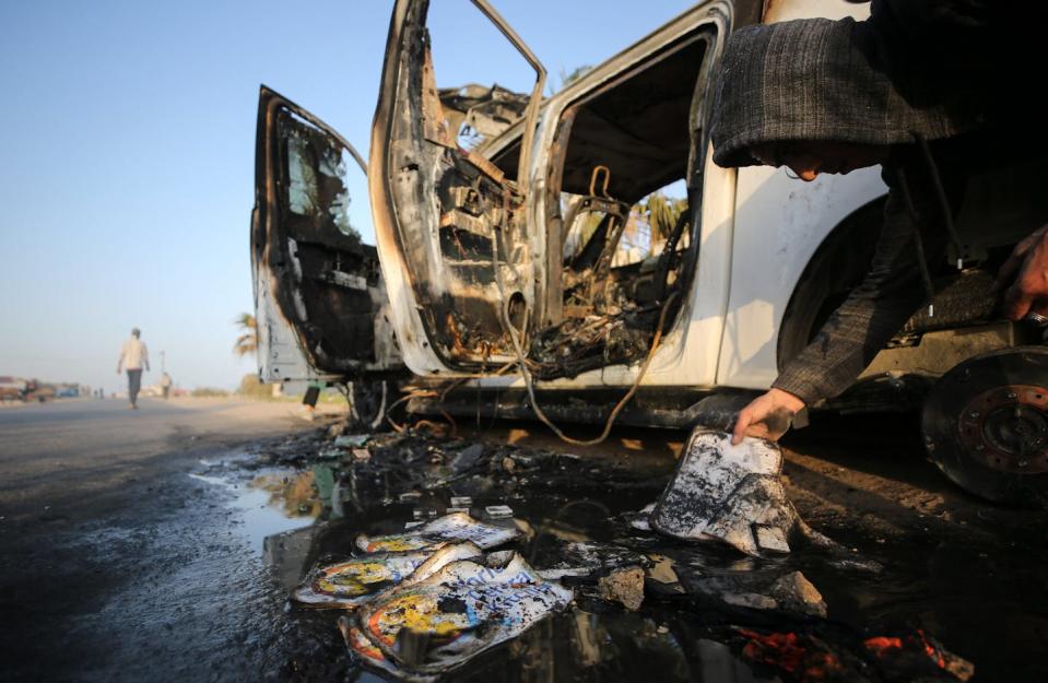 The wreckage of a vehicle that has been bombed and burned.