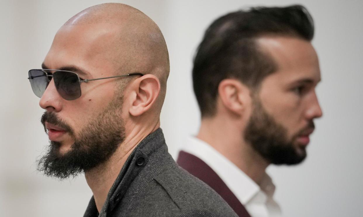 <span>Andrew Tate (left) and his brother, Tristan, at the court of appeal in Bucharest.</span><span>Photograph: Vadim Ghirdă/AP</span>