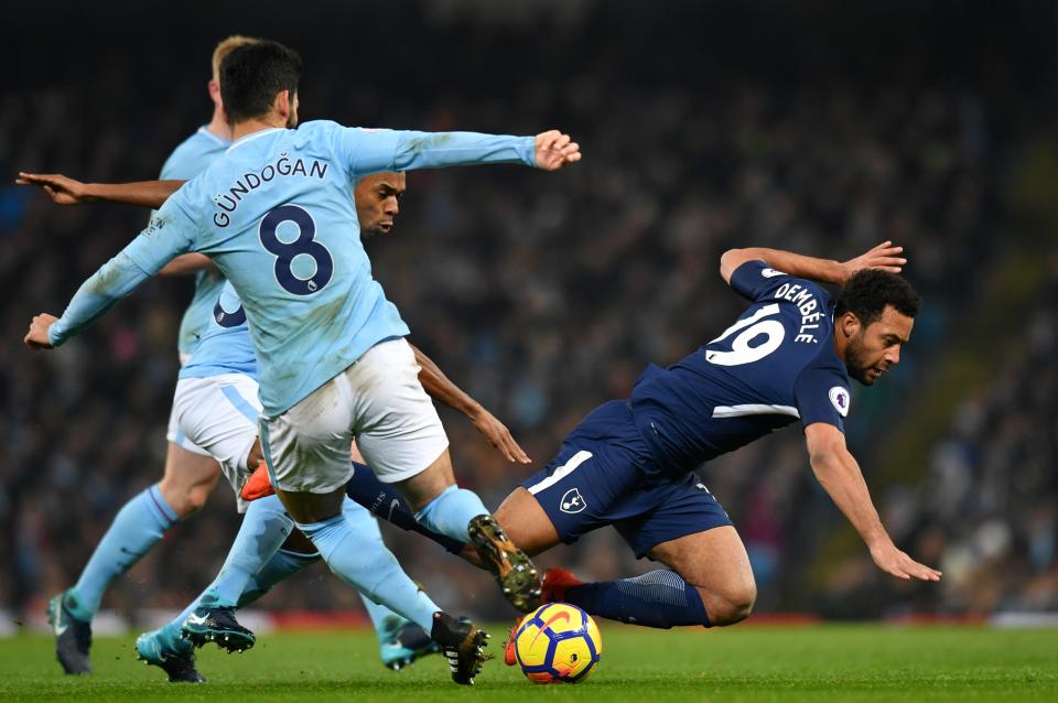 Tottenham Hotspur’s Mousa Dembele trips over a challenge