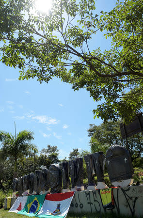 Black plastic bags with taped crosses cover stone letters of the name Brumadinho, after a dam owned by Brazilian mining company Vale SA collapsed, in Brumadinho, Brazil February 1, 2019. REUTERS/Washington Alves