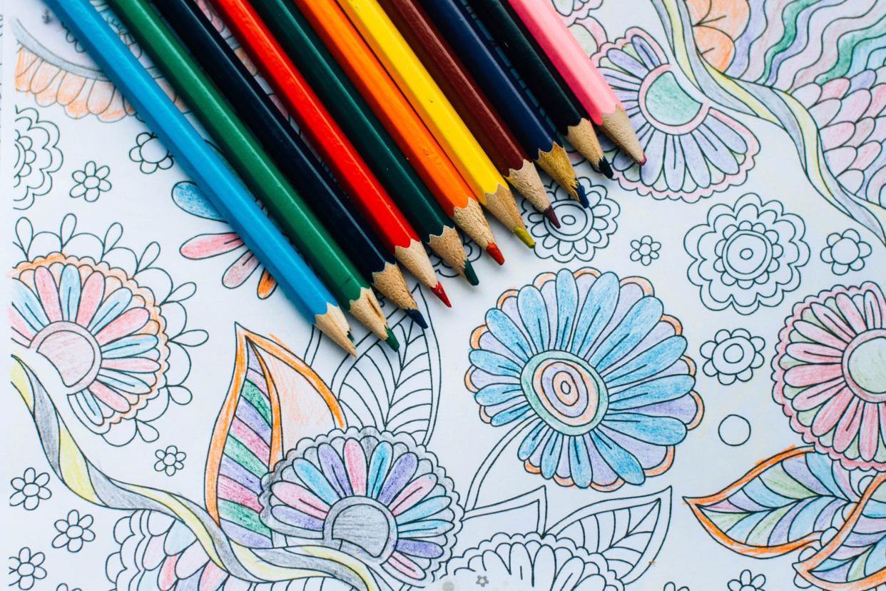 colored pencils and coloring book