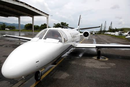 Pilot Nicolas Veloz prepares for takeoff in a private plane at Charallave airport outside Caracas September 15, 2014. REUTERS/Carlos Garcia Rawlins