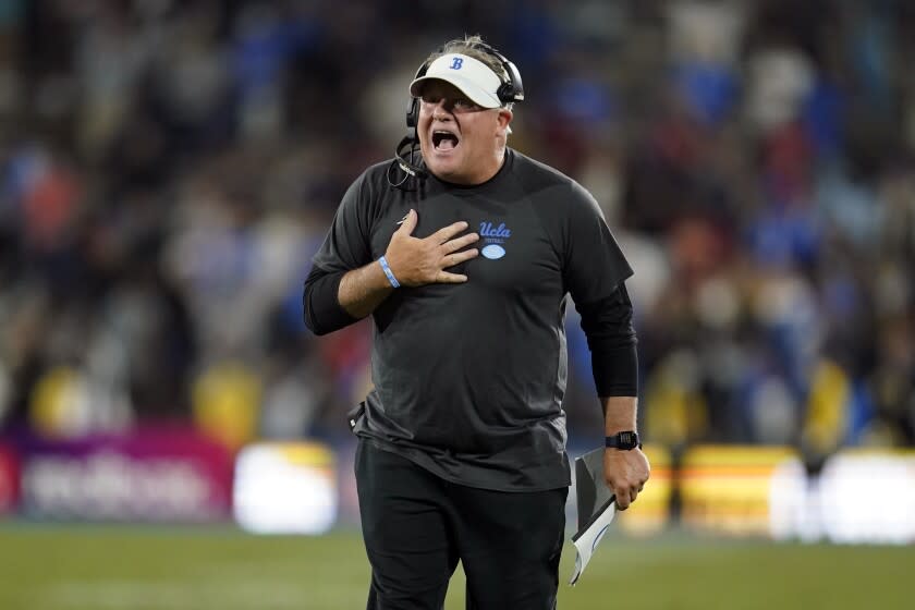 UCLA head coach Chip Kelly yells instructions at one of his players during the second half of an NCAA college football game against Fresno State Sunday, Sept. 19, 2021, in Pasadena, Calif. (AP Photo/Marcio Jose Sanchez)