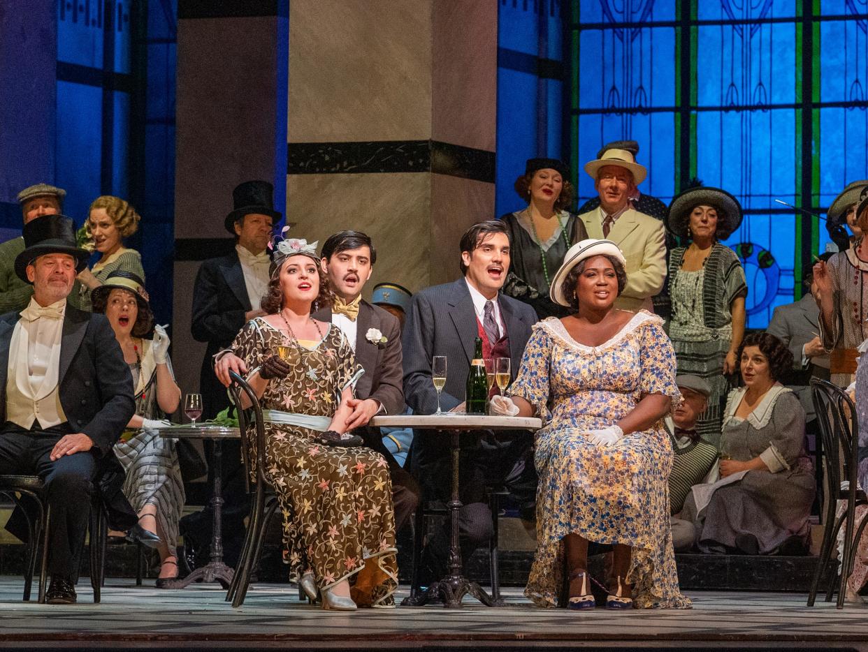 Whitefish Bay native Emily Pogorelc, seated at center left, sings in The Metropolitan Opera's "La Rondine."