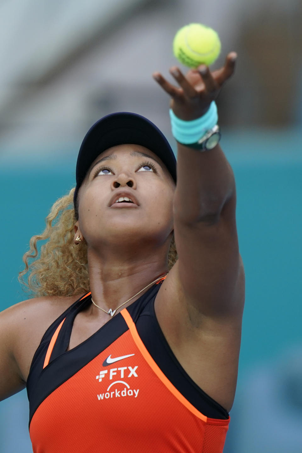 Naomi Osaka, of Japan, serves to Alison Riske during the Miami Open tennis tournament, Monday, March 28, 2022, in Miami Gardens, Fla. (AP Photo/Wilfredo Lee)