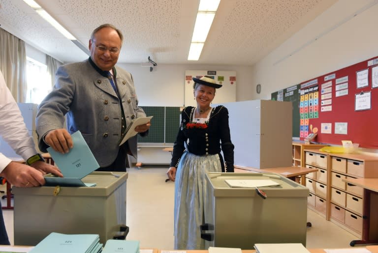 Voters, some dressed in typical Bavarian outfits, sent a message to Berlin as the three parties in the fragile coalition government suffered major losses in Bavaria's state election
