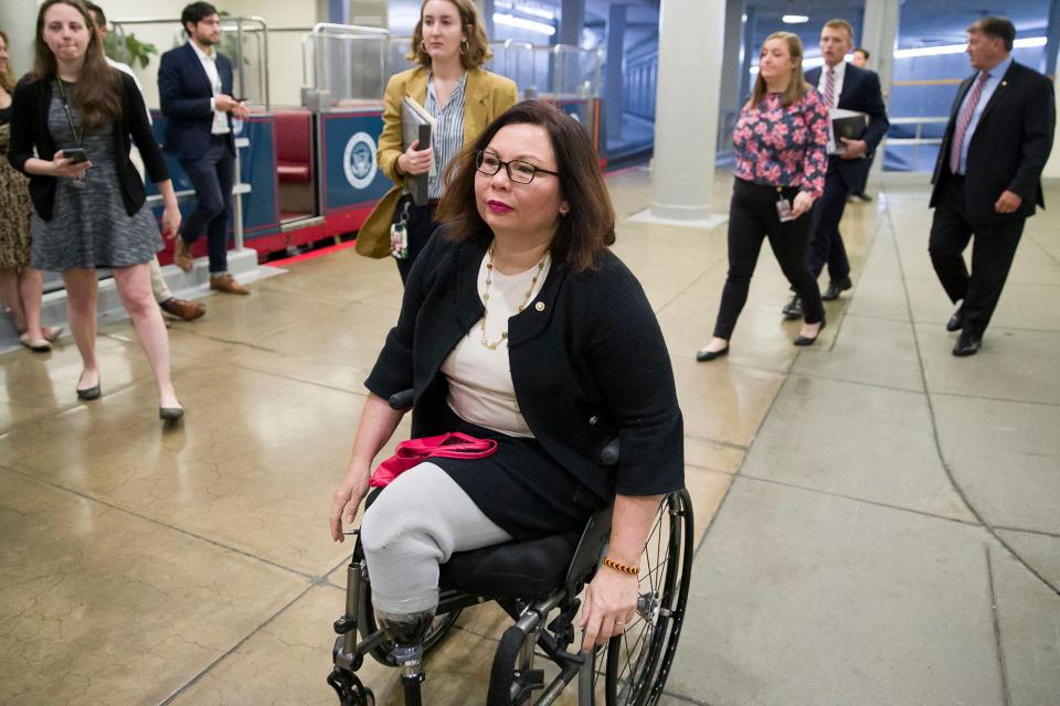 Sen. Tammy Duckworth, R-Ill., heads to the Senate for a vote, on Capitol Hill on Sept. 24, 2019, in Washington. The Army veteran lost both legs when the helicopter she was in was struck by a rocket-propelled grenade during a September 2004 mission near Baghdad.