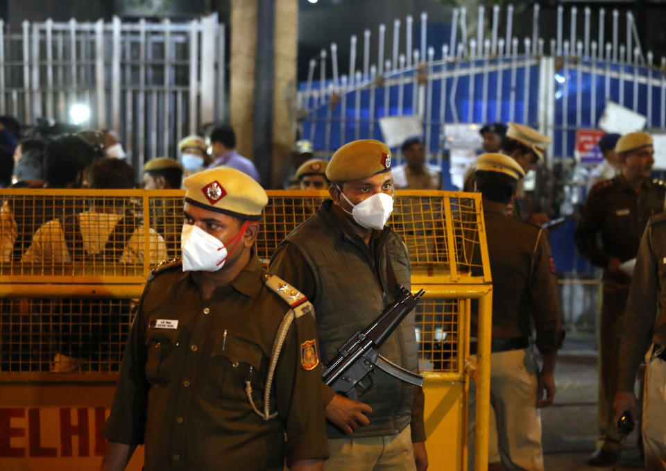 Image: Policemen stand guard at the entrance of Tihar central prison where four men were sentenced to capital punishment in New Delhi (Manish Swarup / AP)