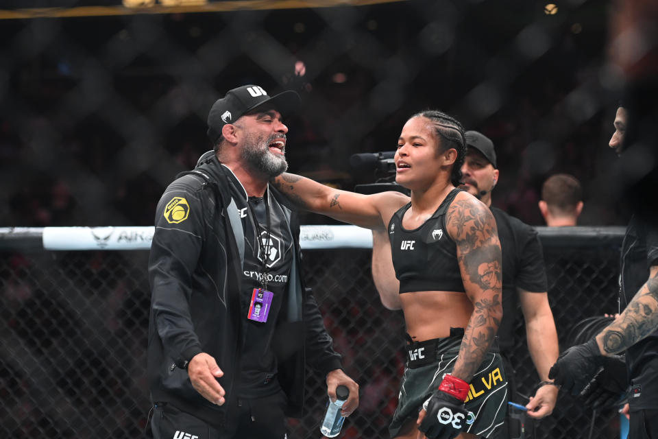 Aug 19, 2023; Boston, MA, USA; Karine Silva (red gloves) reacts to defeating Marina Moroz (blue gloves) during UFC 292 at TD Garden. Mandatory Credit: Bob DeChiara-USA TODAY Sports