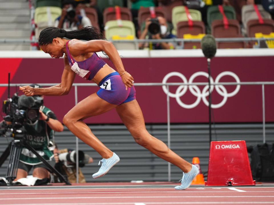 Allyson Felix runs at the Tokyo Olympics.
