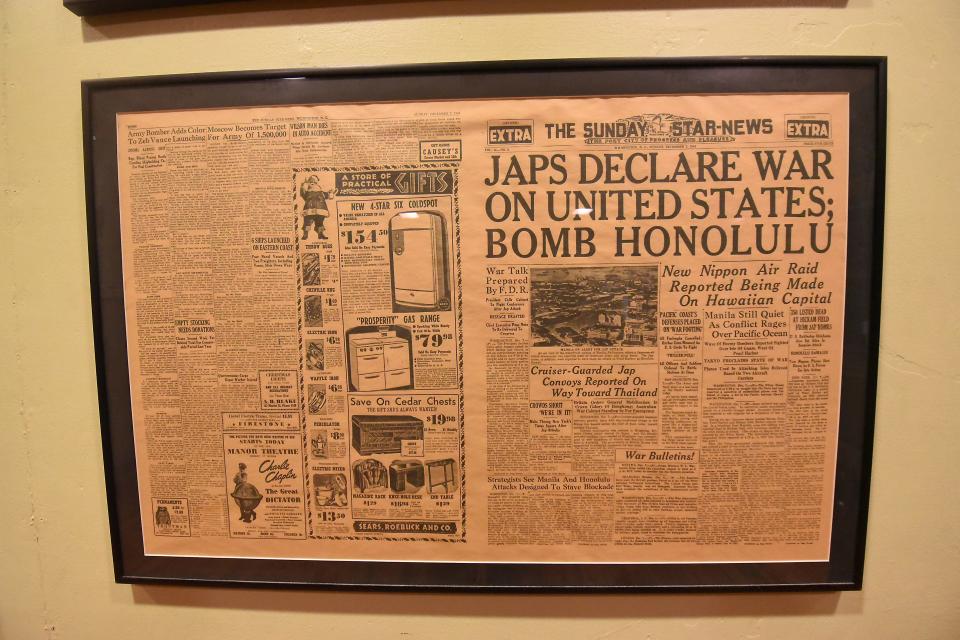 A copy of the Sunday StarNews from Dec. 7, 1941 hangs on the wall during the Commemoration Pearl Harbor USO Dance by World War II Wilmington Home Front Heritage Coalition and the Hannah Block Historic USO/Community Arts Center in 2018. [KEN BLEVINS/STARNEWS]