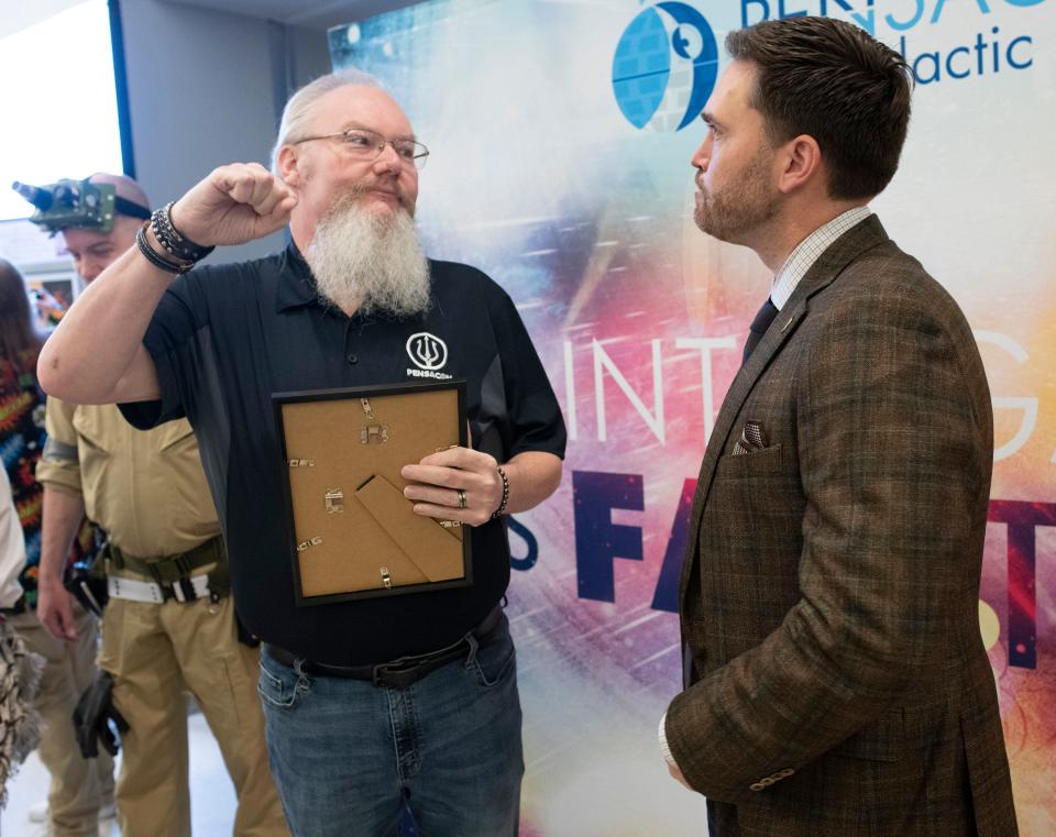 Pensacon CEO Mike Ensley chats with Pensacola Mayor D.C. Reeves after the annual event ceremonially renaming the Pensacola International Airport the Pensacola Intergalactic Airport to honor the annual Pensacon pop culture convention.