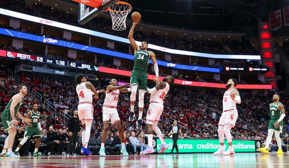 Bucks forward Giannis Antetokounmpo dunks the ball for two of his 48 points against the Houston Rockets on Saturday night.