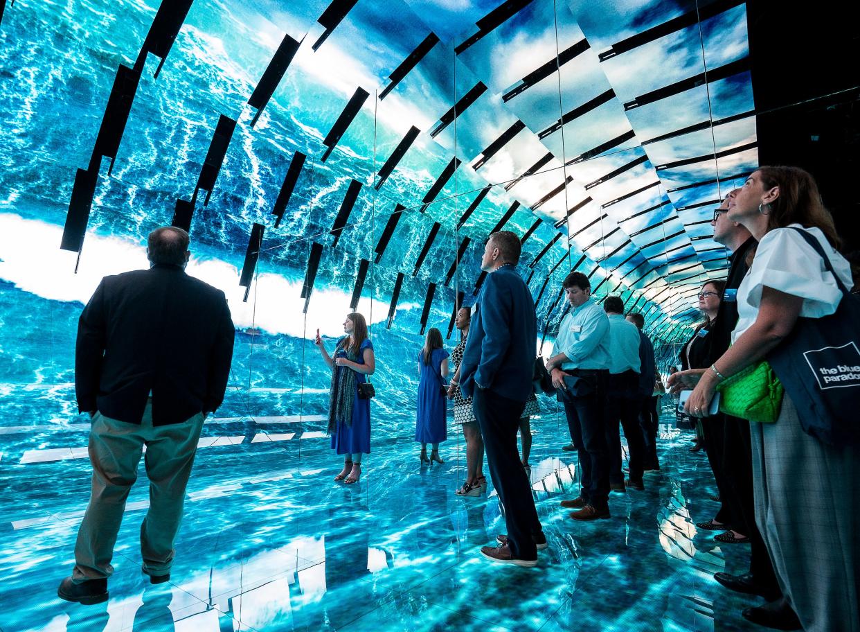 Spectators attend the opening of the Blue Paradox, an immersive experience on the ocean plastic crisis, presented by SC Johnson in partnership with Conservation International on Wednesday June 28, 2023 at the Museum of Science & Industry in Chicago, Illinois.