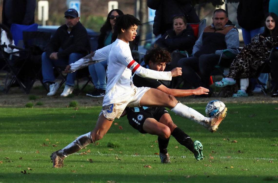 Clovis High captain Sylas Sells blocks a pass from a Clovis North player during a TRAC soccer match at Clovis Community College on Jan. 18, 2023. The state’s top-ranked boys team, Clovis North, scored a 2-1 win.