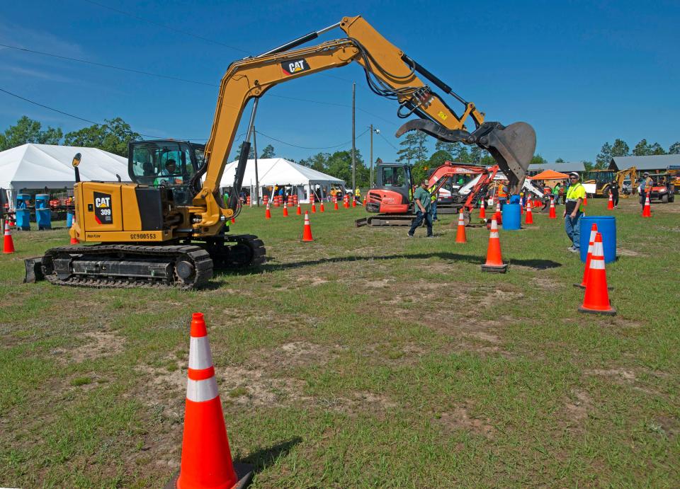 Students in Escambia and Santa Rosa counties learn more about jobs in the construction industry during the Construction Career Day event in Santa Rosa County on Wednesday.