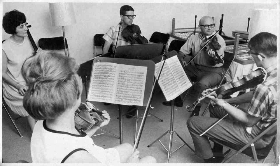 Paul Wolfe, second from right, the third and longest-serving music director in the history of the Sarasota Orchestra, working with fellows during the 1966 Sarasota Music Festival. He started the festival in 1966.