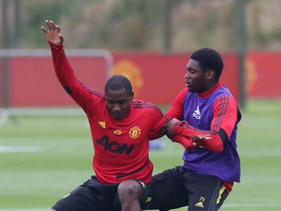 Teden Mengi (right) is one of two Manchester United youngsters to be called into the Europa League squad (Manchester United via Getty Images)