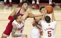 Indiana's Trayce Jackson-Davis, top left, reaches for a rebound against Nebraska's C.J. Wilcher (0), Trey McGowens, top right, and Bryce McGowens (5) during the second half of an NCAA college basketball game Monday, Jan. 17, 2022, in Lincoln, Neb. (AP Photo/Rebecca S. Gratz)