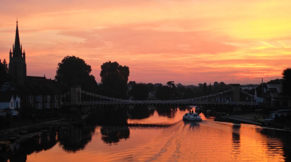 The sun rises over the town of Marlow, Buckinghamshire and its Grade 1 listed bridge which spans the River Thames, as forecasters predict the high temperatures are set to continue through the weekend, peaking as high as 33C on Saturday. Picture date: Friday September 8, 2023. (Photo by Jonathan Brady/PA Images via Getty Images)