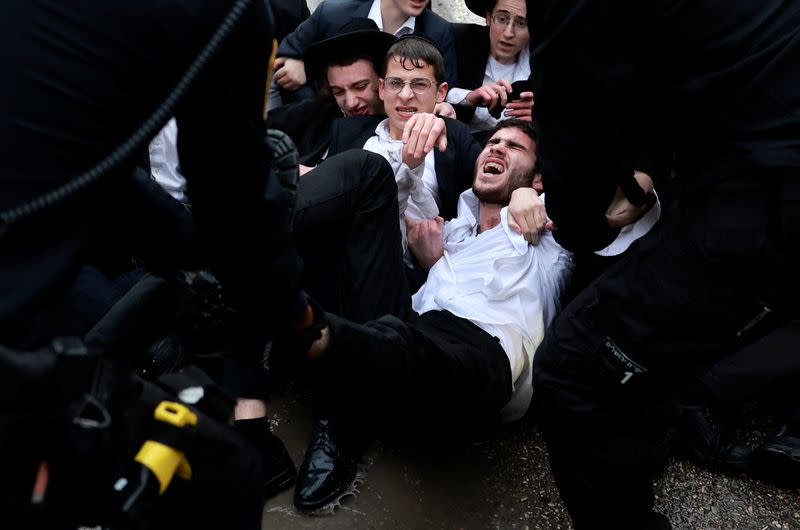 FILE PHOTO: Protest against attempts to change government policy that grants ultra-Orthodox Jews exemptions from military conscription, in Jerusalem
