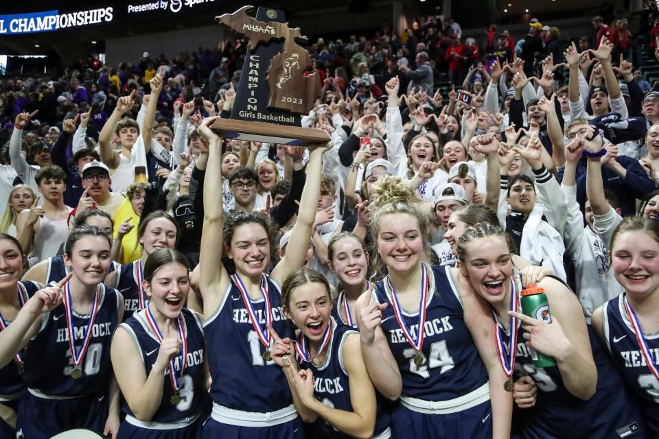 Hemlock players and student section celebrate the 59-43 win in the Division 3 girls basketball final at Breslin Center on Saturday, March 18, 2023.