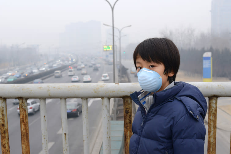 <span class="caption">Sickening smog in Beijing.</span> <span class="attribution"><a class="link " href="https://www.shutterstock.com/image-photo/asian-boy-wearing-mouth-mask-against-178208156" rel="nofollow noopener" target="_blank" data-ylk="slk:Shutterstock/Hung Chung Chih;elm:context_link;itc:0;sec:content-canvas">Shutterstock/Hung Chung Chih</a></span>