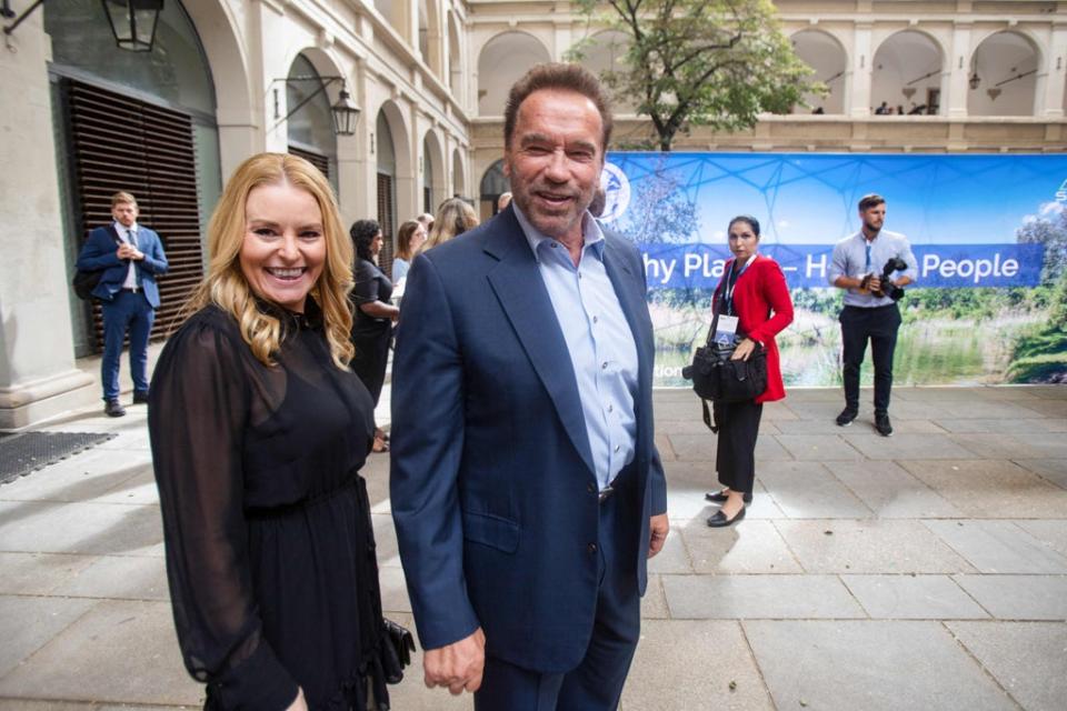 Schwarzenegger and his partner Heather Milligan (AFP via Getty Images)