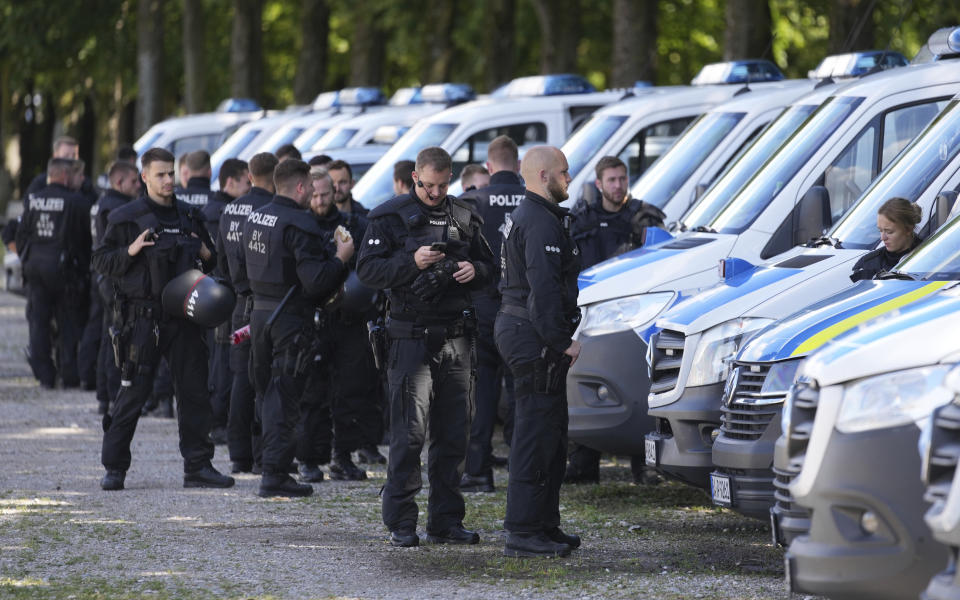 Police prepare their equipment and gather prior to a demonstration ahead of the G7 summit in Munich, Germany, Saturday, June 25, 2022. The G7 Summit will take place at Castle Elmau near Garmisch-Partenkirchen from June 26 through June 28, 2022. (AP Photo/Matthias Schrader)