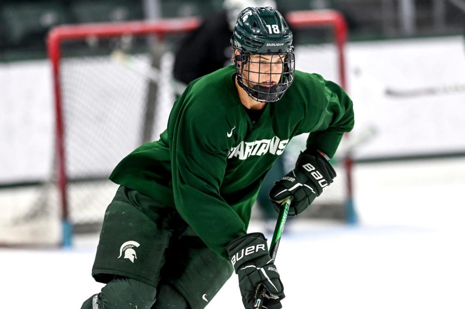 Michigan State's Joey Larson moves the puck in practice during hockey media day on Wednesday, Sept. 27, 2023, at Munn Arena in East Lansing.