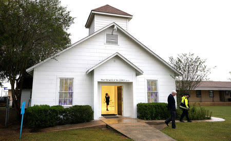 A member of the media walks inside the First Baptist Church of Sutherland Springs where 26 people were killed one week ago, as the church opens to the public as a memorial to those killed, in Sutherland Springs, Texas, U.S. November 12, 2017. REUTERS/Rick Wilking