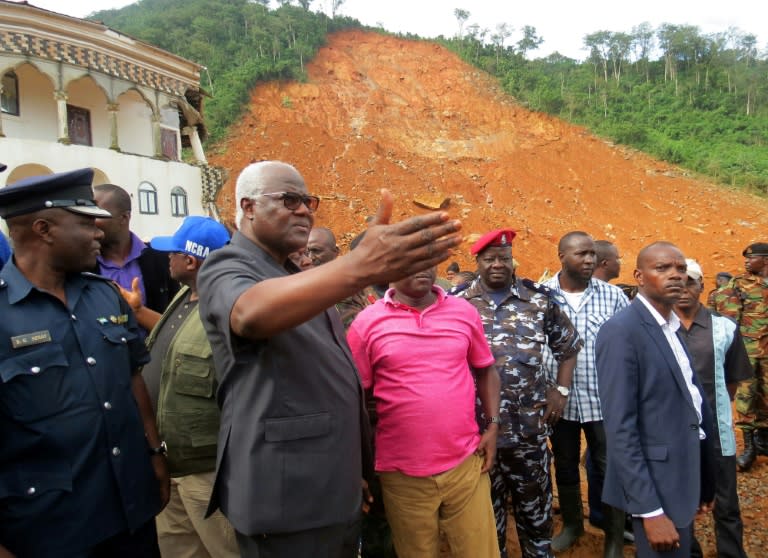 Sierra Leone President Ernest Bai Koroma fought back tears on Tuesday as he visited the devastated hilltop community of Regent, saying the scale of the challenge ahead was "overwhelming us"