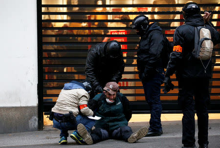 A protester is detained during a demonstration of the "yellow vests" movement in Nantes, France, January 12, 2019. REUTERS/Stephane Mahe