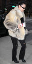 <p>The model bundled up in a beige fur coat, black ripped flare jeans (shop a similar look <a rel="nofollow noopener" href="https://click.linksynergy.com/fs-bin/click?id=93xLBvPhAeE&subid=0&offerid=277749.1&type=10&tmpid=2678&RD_PARM1=http%3A%2F%2Fwww.yoox.com%2FUS%2F42567963%2Fitem%3Fcod10%3D42567963HK%2526tp%3D48213%2526utm_campaign%3DJeans%2520%2524200-399_desktop%2526utm_medium%3Dshopping%2526utm_source%3Dpolyvore&u1=ISBellaHSSJeansIJApril" target="_blank" data-ylk="slk:here;elm:context_link;itc:0;sec:content-canvas" class="link ">here</a>), and matching Winona boots by Sol Sana.</p>