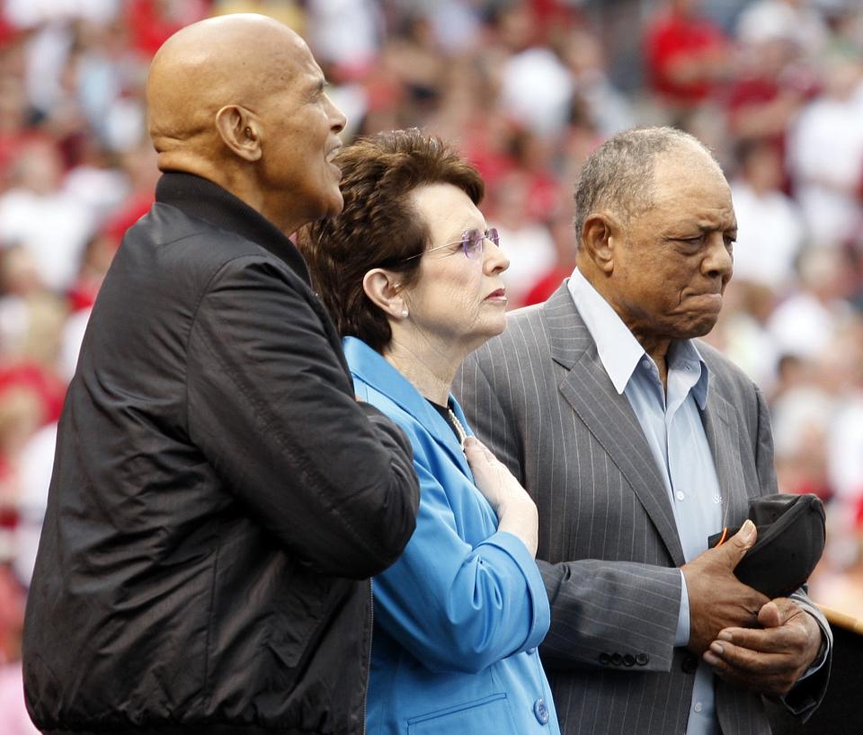 MLB Beacon Awards honorees Harry Belafonte (L-R), Billie Jean King and Willie Mays during the singing of the National Anthem at the Civil Rights Game at Great American Ball Park in 2010.