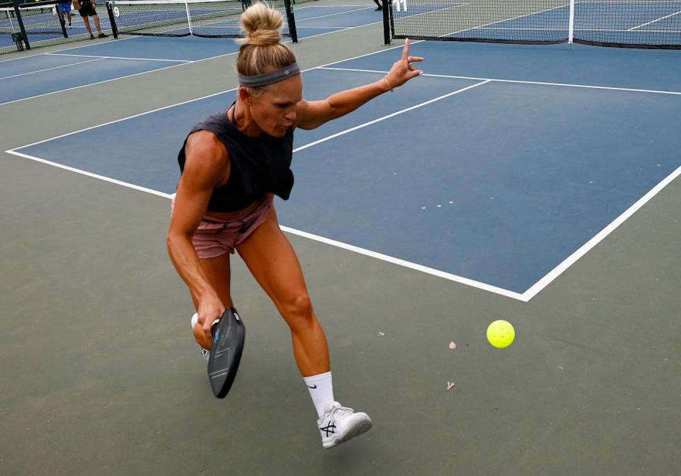 Pickleball seems to have more gender parity than other sports. <a href="https://www.gettyimages.com/detail/news-photo/melanie-beckstrand-returns-a-shot-against-kelly-mceniry-news-photo/1421105751?phrase=pickleball&adppopup=true" rel="nofollow noopener" target="_blank" data-ylk="slk:Ronald Martinez/Getty Images;elm:context_link;itc:0;sec:content-canvas" class="link ">Ronald Martinez/Getty Images</a>