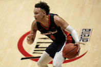 Pepperdine guard Colbey Ross dribbles the ball during the second half of the team's NCAA college basketball game against UCLA, Friday, Nov. 27, 2020, in San Diego. (AP Photo/Gregory Bull)