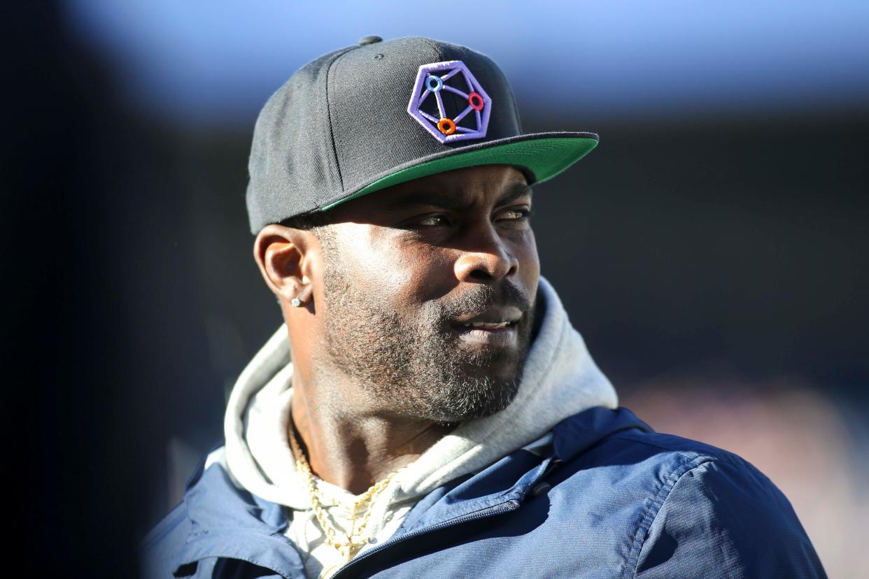 Former Atlanta Falcons quarterback Michael Vick watches a game between the Atlanta Legends and Birmingham Iron 2019 at Georgia State Stadium.