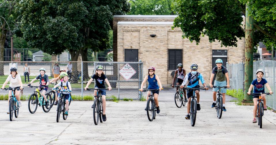 MKE MTB students practicing at MacDowell Montessori School make their way to a nearby bike path on Thursday, July 21, 2022.