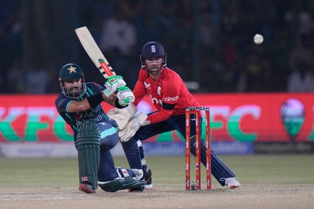 Mohammad Rizwan, left, sweeps during his innings of 68