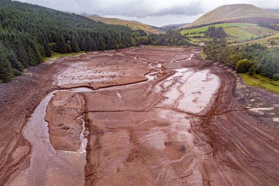 General views of Cantref Reservoir in Brecon Beacons National Park, Wales, where water levels are low. (PA)