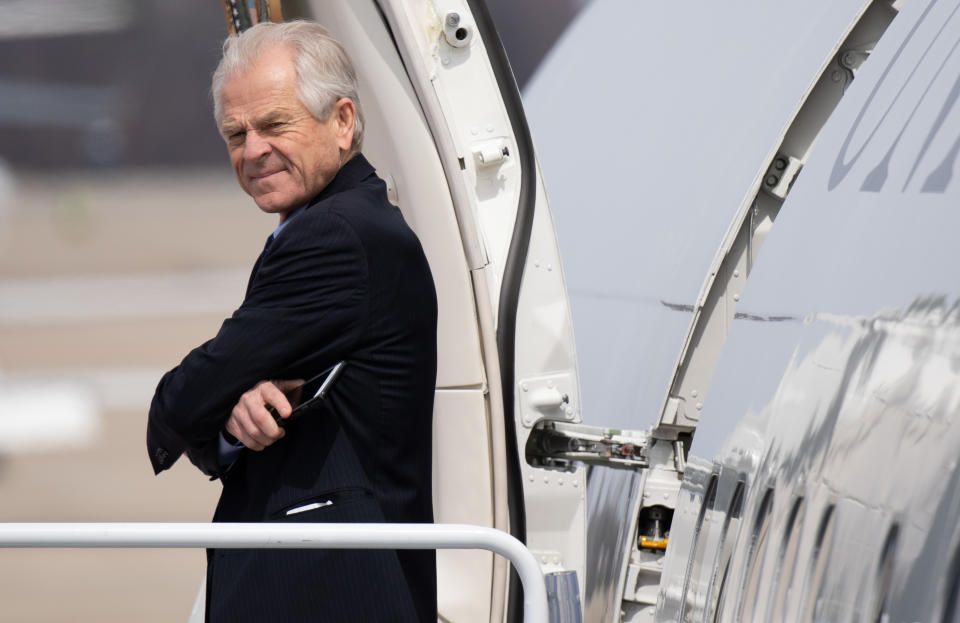 Peter Navarro, director of the Office of Trade and Manufacturing Policy, prepares to board Air Force One with US President Donald Trump prior to departure from Joint Base Andrews in Maryland, March 20, 2019, as he travels to visit a military manufacturing facility and attend a fundraiser in Ohio. (Photo by SAUL LOEB / AFP)        (Photo credit should read SAUL LOEB/AFP/Getty Images)