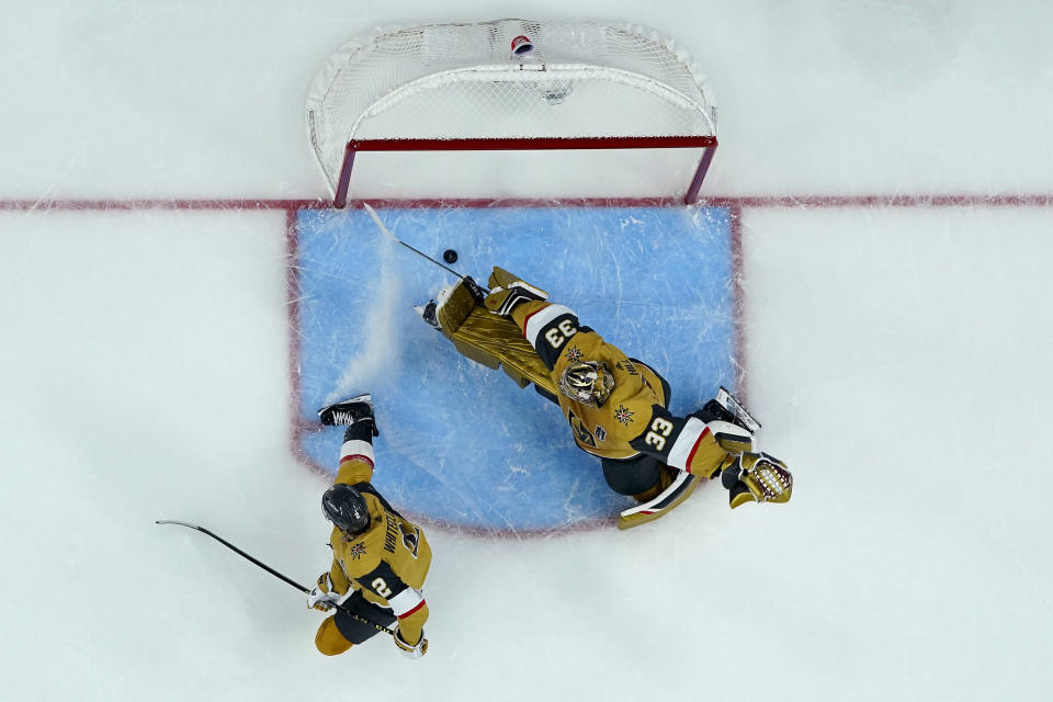 Vegas Golden Knights goaltender Adin Hill (33) can't stop a goal during the third period of Game 2 of the NHL hockey Stanley Cup Finals against the Florida Panthers, Monday, June 5, 2023, in Las Vegas. The Golden Knights defeated the Panthers 7-2 to take a 2-0 series lead. (AP Photo/Abbie Parr)