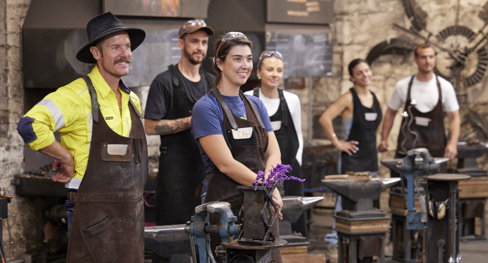 The Block's teams competing in a blacksmith challenge.