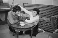 <p><em>The Wizard of Oz</em> star Judy Garland and musician Mickey Deans enjoy a cup of tea on the floor of their London home the morning of their wedding, March 15, 1969.</p>