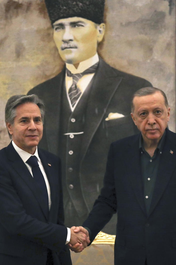 U.S. Secretary of State Antony Blinken, left, shakes hands with Turkish President Recep Tayyip Erdogan during their meeting at Esenboga airport in Ankara, Turkey, Monday, Feb. 20, 2023. Blinken is on his first trip to NATO ally Turkey since he was appointed two years ago. (AP Photo/Burhan Ozbilici, Pool)