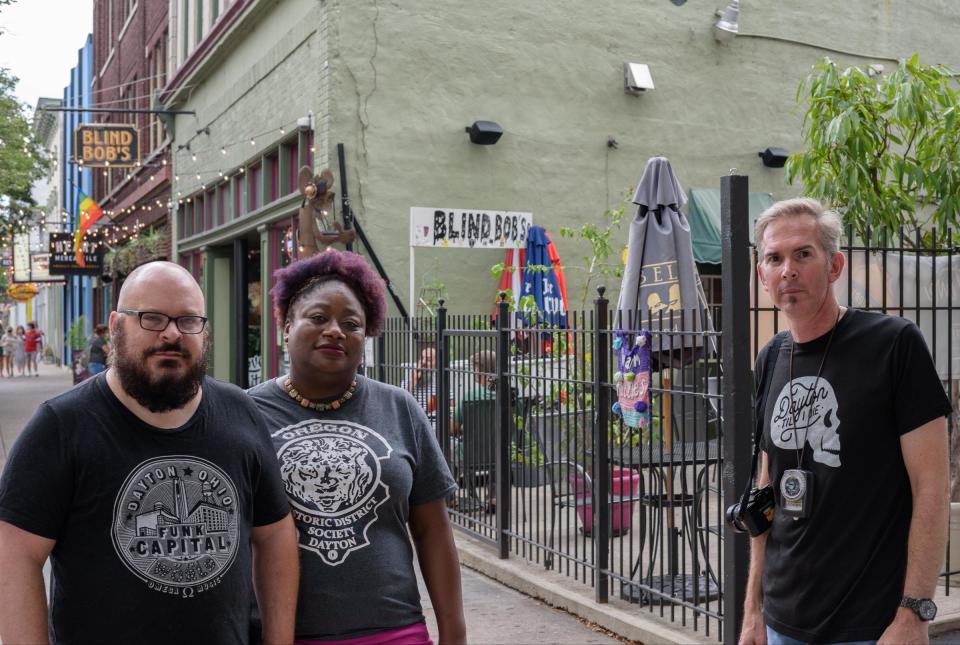 Dayton Daily News journalists, from left: Anthony Shoemaker and Amelia Robinson and former DDN photojournalist Ty Greenlees revisited the scene of the 2019 mass shooting in the Oregon District on Saturday before the one-year anniversary.