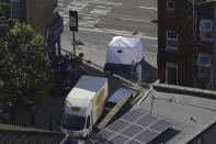 <p>A forensic officer stands at the scene with a van near Finsbury Park station after the vehicle struck pedestrians in north London, Monday June 19, 2017. Police said a man who was driving the car has been arrested and taken to a hospital as a precaution. (Photo: Tim Ireland/AP) </p>